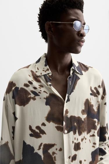 CAMISA COM ESTAMPADO ANIMAL PRINT