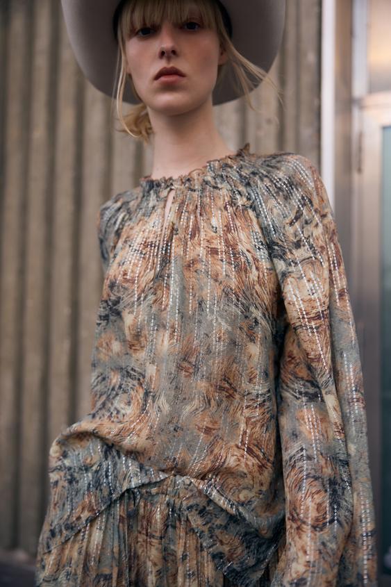 BLUSA SEMITRANSPARENTE ESTAMPADA