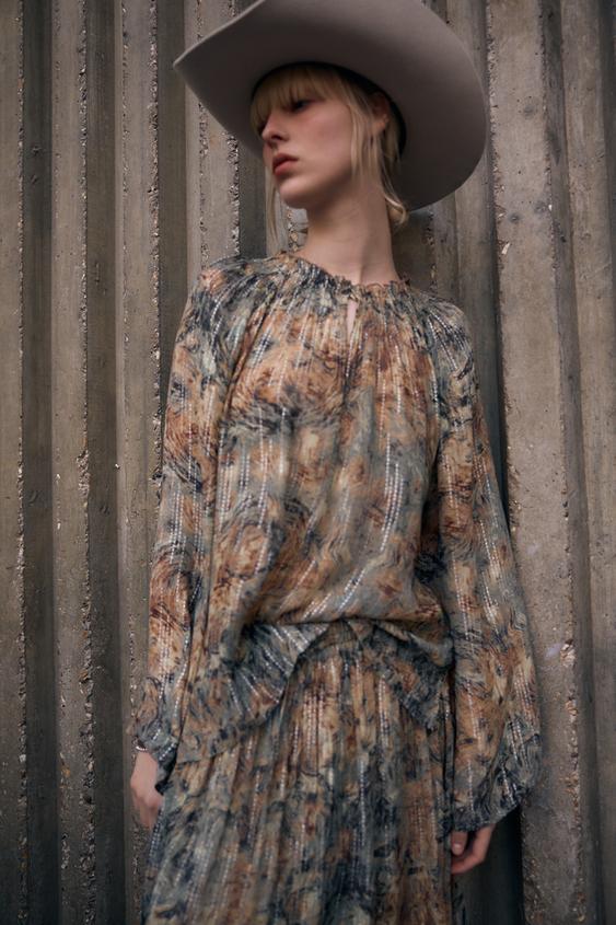 BLUSA SEMITRANSPARENTE ESTAMPADA