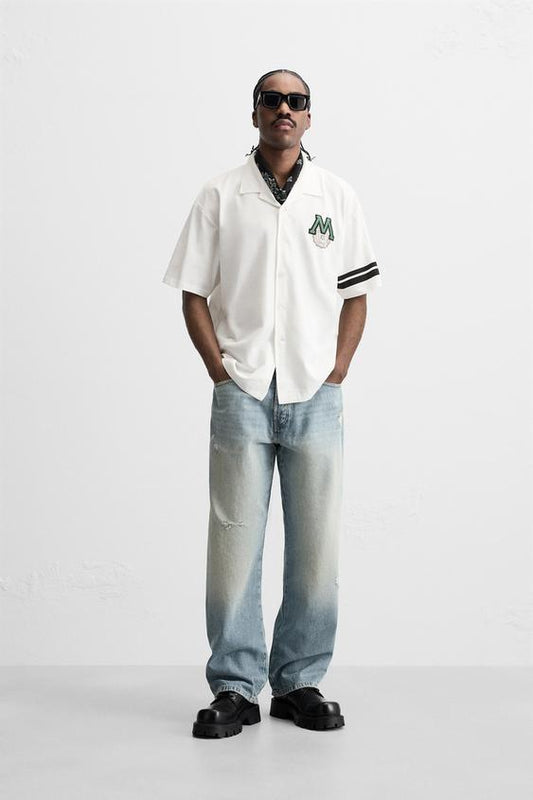 CAMISA COM REMENDO COMBINADO