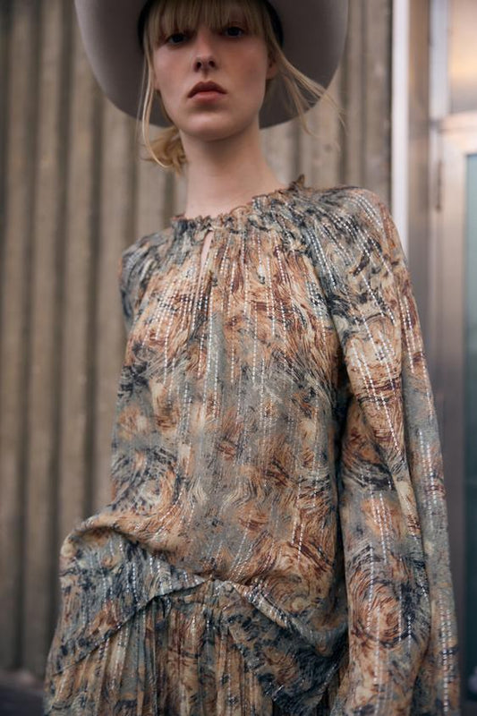 BLUSA SEMITRANSPARENTE ESTAMPADA